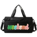 Detail of black gym bag with colorful chenille 'weekend' patch and sturdy handles. - Black