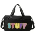 Detailed front view of a black sports bag featuring colorful fuzzy STUFF lettering - Black