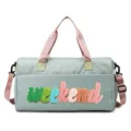 Close-up of a light green duffle bag with colorful 'weekend' chenille embroidery. - Green and Pink