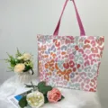 Detailed view of large capacity tote bag with colorful leopard print and pink straps - Colorful Leopard Print