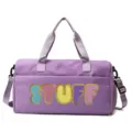 Detailed view of purple large capacity gym bag with colorful STUFF letter patches - Purple