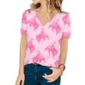 Detail view of women's loose V-neck T-shirt with hot pink western cowboy print - Cowboy