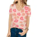 Detail shot of a women's V-neck short sleeve T-shirt featuring a pink heart leopard print - S / Colorful Leopard 3