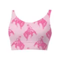 Close-up of pink women's cropped tank top showing repeating cowboy riding print - Cowboy