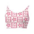 Close-up detail of women's crop top featuring pink checkered MAMA and flower pattern - Letter 1