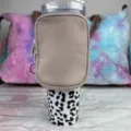 Detail view of khaki neoprene pouch attached to a 40oz leopard print tumbler - Khaki