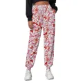 Close-up of women's white sweatpants with red bow patterns, elastic drawstring waist details. - Bowknot Style