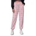 Detail of pink and white checkered sweatpants with MAMA and flower print for casual style. - Pink and White Plaid Style