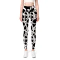 Detailansicht der High-Waist-Yoga-Leggings mit trendigem schwarz-weißem Kuhprint-Muster. - S / Kuhmuster-Stil