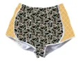 Detailed view of women's high-waisted camouflage sports shorts with yellow side panels - Leopard 4