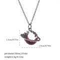 Detail of a Gothic style red crescent moon pendant necklace with pearls and star charms - Moon and Stars