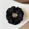 Detailed view of a black fabric hair scrunchie with white abstract pattern for daily styling. - Double Layer Scrunchie / Black Leopard