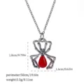 Detailed macro view of gothic black spider pendant with red drop and size information - Black Spider