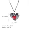 Macro detail of a gothic heart pendant necklace showing dimensions and weight metrics. - Heart Stone