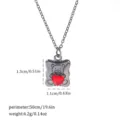 Macro detail view of gothic teddy bear necklace with a red heart gemstone and size info - Bear Heart