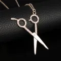 Detailed close-up of a rose gold hairdresser scissor pendant necklace for stylists - Rose Gold