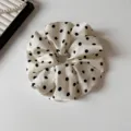 Elegant black and white polka dot satin hair scrunchie detail showing soft fabric and cute pattern. - Off-white Polka Dot Scrunchie