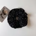 Elegant black hair scrunchie with white bow and dot patterns for women daily chic styling. - Black Satin Scrunchie