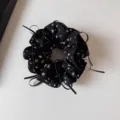 Close-up of black floral scrunchie with cute ribbons, soft fabric and pleated ruffled design. - Black Double Layer Print