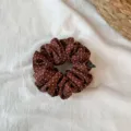 Detailed shot of brown polka dot hair scrunchie, smooth fabric with white dots, ruffles. - Small Reddish Brown Polka Dot Scrunchie