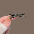 Rhinestone cross hair clip detail view, sparkling crystal hair accessory for elegant hairstyles. - Cross Hairpin - Grey Rhinestone