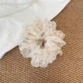 Close-up of soft organza hair scrunchie with colorful polka dots, delicate texture. - L / Rainbow Polka Dot