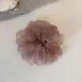 Detailed close-up of a dusty pink organza hair scrunchie with sparkly rhinestones. - L / Pink