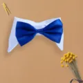 Detail shot of a pet fake collar with a blue bow tie, showing fine fabric and stitching. - Blue