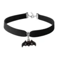 Black velvet choker necklace detail featuring a spooky bat pendant with ghost and cross accents. - Black Ghost Bat