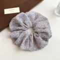 Floral print scrunchie for women, elegant hair accessory with elastic band and soft fabric. - Blue