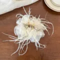 Detail shot of exquisite feather mesh hair claw with pearls for elegant styling and daily look. - Off-White Mesh Claw