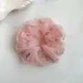 Close-up detail of the pink floral organza hair scrunchie with sparkling rhinestone accents. - Pink Rhinestone Floral