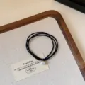 French vintage style hair tie with elegant white pearl, elastic black rubber band for women. - Black