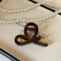 Molletta per capelli in acrilico tartaruga, elegante design a cappio incrociato per acconciature. - 8cm / Colore caramello