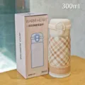 Compact 300ml stainless steel vacuum thermos cup with cute plaid pattern and dual-drink lid. - Plaid Style / Small (300ml) / White