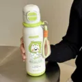 Portable stainless steel thermos water bottle with cute cartoon dog design and strap for daily use. - 500ml / 2193 Series / White Green