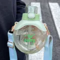 Linde ronde waterfles met riem, groene deksel en helder draagbaar ontwerp voor studenten. - Bolvormig Model (JD2579) / 700ml / Groen