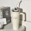 Large capacity stainless steel insulated tumbler with handle and straw for travel and daily use - White