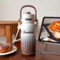 Gradient stainless steel thermos water bottle with strap and handle for outdoor portable daily use. - 700ml / Brown