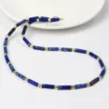 Modieuze blauwe edelsteen buis kralen ketting met gouden spacers voor elegante dames nu. - Lapis Blauw