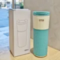 Stylish stainless steel coffee cup with silicone sleeve, 500ml vacuum insulated travel mug for daily use. - Blue