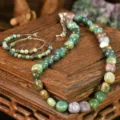 Close-up detail of natural Indian agate irregular gemstone beaded necklace and hoop earrings. - Indian Agate Necklace And Earrings