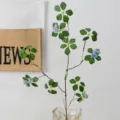 Artificial plant branch with green leaves and blue flowers for home dining table decor. - Short Branch / Blue