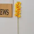 Yellow 9-head artificial cymbidium orchid branch for home wedding decor and floral arrangement. - Cymbidium 9 Heads Yellow