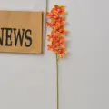 Stelo di orchidea cymbidium artificiale con 9 teste arancioni per decorazione casa e matrimonio. - Cymbidium 9 Teste Corallo
