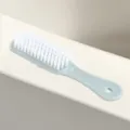 Light blue plastic shoe brush with white hard bristles for household laundry and daily cleaning. - Plain Blue