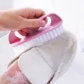 Plastic laundry brush with soft bristles, ideal for household shoe cleaning and clothes washing. - Pink