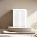 Minimalist white mini storage cabinet on stylish display podium for home decor and organization. - 17*25