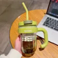 Green plastic water bottle with straw, tea infuser and handle for office and student use. - 540ml / Green
