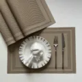 Woven PVC placemat set for dining table, brown heat-resistant non-slip table mat detail view. - Champagne Double Frame